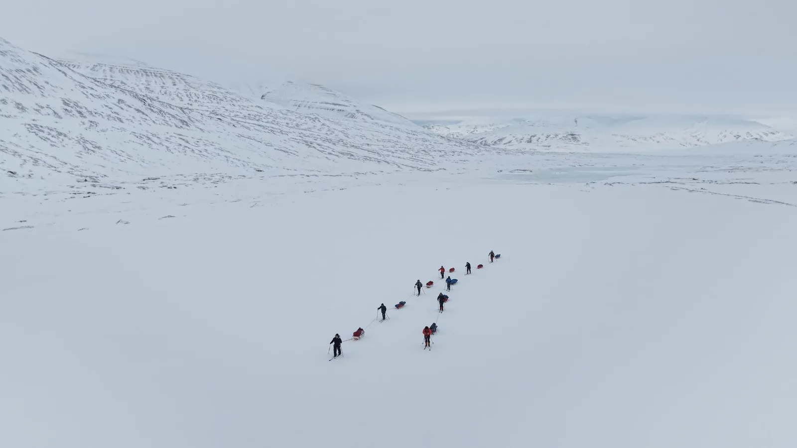 The group from above, crossing the flat, shot in the high passes
