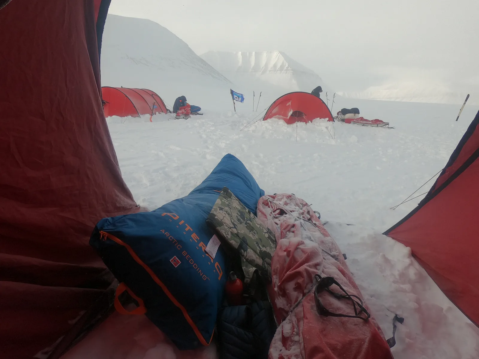 The view from the tent door, Piteraq bedding bag on the pulk